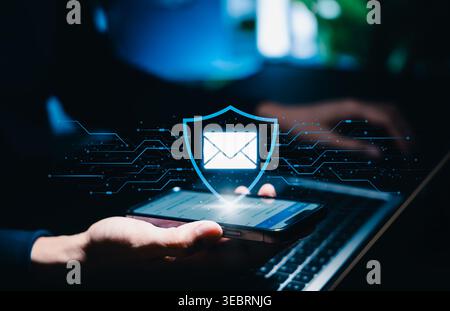 Secure email protection and message security concept. Person holding smartphone with shield and envelope icon. encrypted communication, inbox privacy, Stock Photo