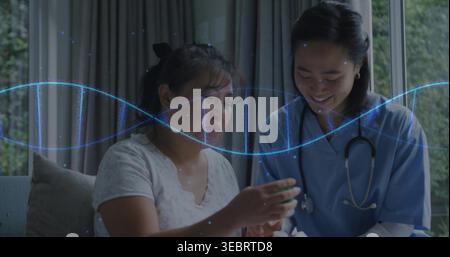 Checking woman on sofa at home, nurse in scrubs holding stethoscope, woman holding bottle, waveform Stock Photo