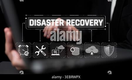 Disaster recovery process concept with focused business professional examining technology and data protection graphic on laptop screen Sigmoid Stock Photo