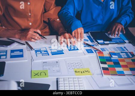 UXUI design brainstorming session with sketches and digital tools Stock Photo