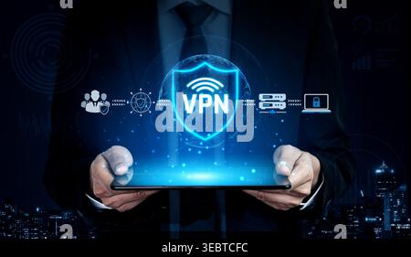 Modern businessman using a digital tablet displaying a VPN shield icon, symbolizing online security and data protection in a digital world Sigmoid Stock Photo