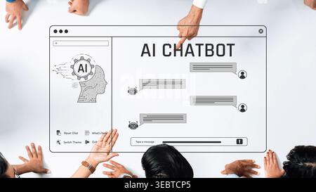 Aerial view of hands interacting with a computer screen displaying an AI chatbot conversation, highlighting teamwork and modern communication in the Stock Photo