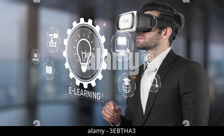 A business professional with a virtual reality headset explores innovative e-learning options in a modern office, showcasing the future of interactive Stock Photo
