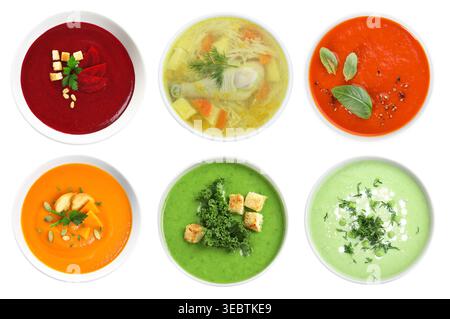 Different tasty soups in bowls isolated on white, collage. Top view Stock Photo