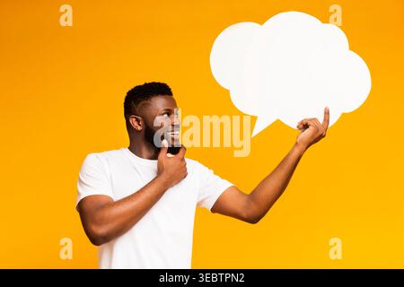 African-american man looking at blank speech bubble Stock Photo