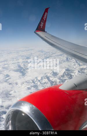 Scenic aerial view from a Jet2 aircraft window flying over snow-capped mountains during a flight from Manchester to Antalya, March 13, 2026. Stock Photo