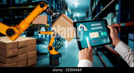 Smart robot arm systems for innovative warehouse and factory digital technology . Automation manufacturing robot controlled by industry engineering Stock Photo