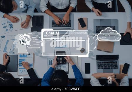 A dynamic meeting scene featuring professionals engaged in discussion, utilizing technology, with artificial intelligence and data visualization Stock Photo