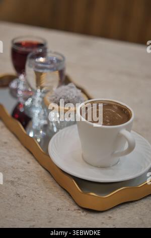 Turkish coffee and drinks served on a tray in a cafe setting Stock Photo