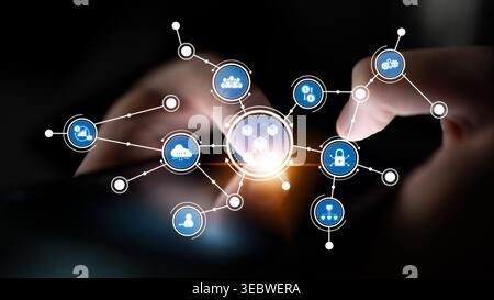 Hands interact with a smartphone displaying interconnected digital icons, symbolizing technology and communication in a modern interconnected world Stock Photo