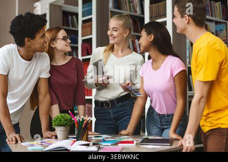 Group of Students Collaborating on a Project in a Library During Daytime Stock Photo