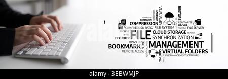A close-up of hands on a keyboard surrounded by a creative word cloud that illustrates key concepts of file management and cloud storage in a digital Stock Photo