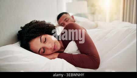 Woman, man and sleeping in bed with peace, tired couple or tranquility for dreaming together in home. Exhausted, married people and calm in house with Stock Photo