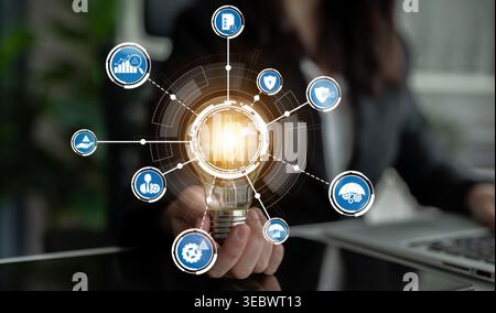 A light bulb symbolizes innovative concepts with interconnected icons representing various business strategies and technologies for effective planning Stock Photo