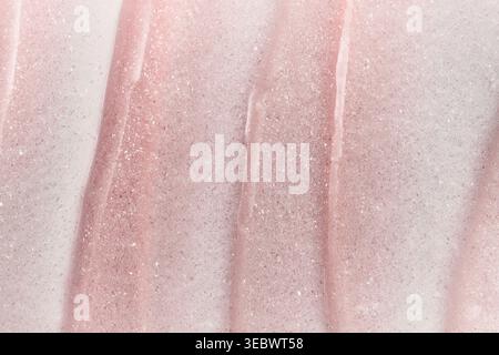 Shimmering pink cosmetic cream texture creating beautiful abstract background Stock Photo