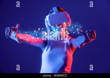 A user immersed in a virtual reality experience, showcasing interaction with vibrant digital elements. This image captures the excitement of Stock Photo