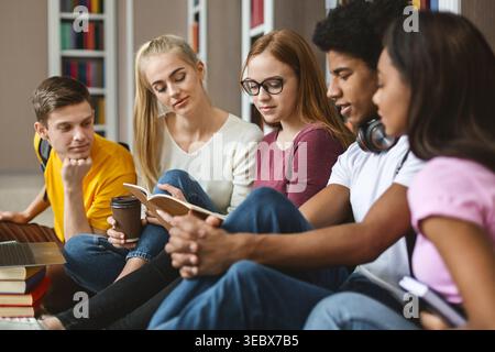 Group of Students Studying Together in a Library During the Afternoon Stock Photo