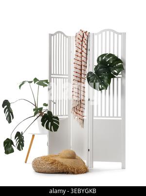Modern folding screen, pouf and houseplants isolated on white background Stock Photo