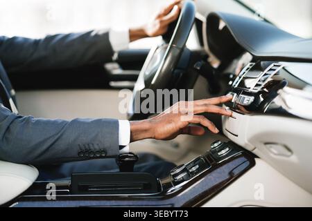 Collage of Hand Reaching for Car Controls in Luxury Vehicle Cabin Setting Stock Photo