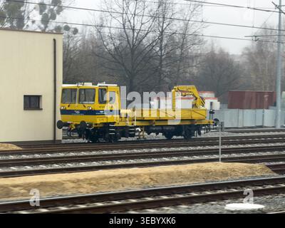 Katowice, Poland - December 3, 2025: PKP Polskie Linie Kolejowe engine on track for industrial support and essential system repair task on overcast da Stock Photo