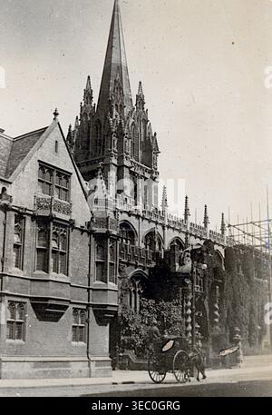 Broad Street façade of Balliol College, 1899, shows a tall Gothic frontage with pointed arches, carved stonework and a rising spire. A figure pulling a rickshaw moves along the street, forming a lively late‑Victorian academic and architectural scene. From a late Victorian album of small photographs taken by an amateur photographer. Most date between 1898 and 1901 and seem to relate to the family of John White (possibly of Sth London), a builder and contractor. The quality of the original photographs was variable and many were faded and discoloured. Stock Photo