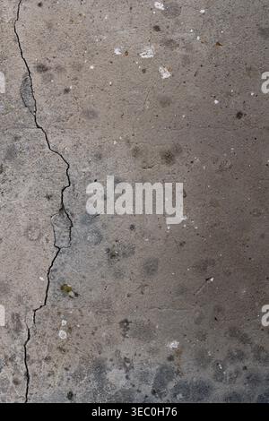 Abstract Grey Concrete Cracked Surface Texture Rough Uneven Granular Detail Subtle Hues Gentle Gradient Lighting Sharp Focus Backdrop for Designs. Stock Photo