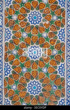 Closeup view of ancient colorful ceramic tiles panel with geometric floral motif on wall of Makhdum Nuh tomb, Hala, Sindh, Pakistan Stock Photo