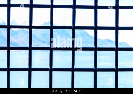 Close-up metal grating on window or prison cell Stock Photo