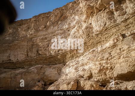 Marsa alam, egypt 21 april 2026: rough sandstone cliff in marsa alam, egypt, showing layered sediment, erosion patterns and textured arid rock surface Stock Photo