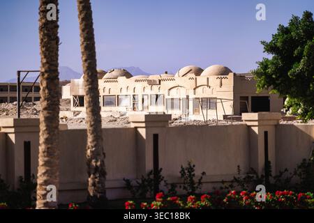 Marsa alam, egypt 21 april 2026: new resort buildings with dome roofs under construction in marsa alam, egypt, showing desert and mountains under clea Stock Photo