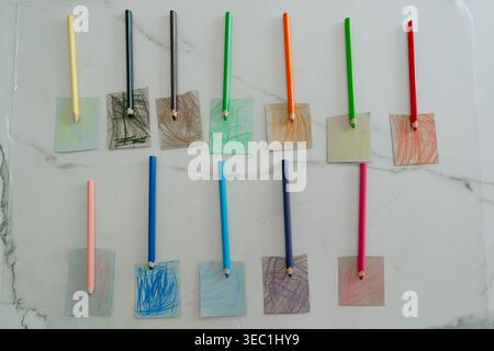 Color samples arranged on wall with sticks. Concept of interior design, paint selection, and creative planning for renovation or decoration. Stock Photo