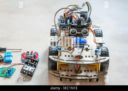 DIY toy Robot Car components. Educational electronics project for STEM learning and robotics. Stock Photo