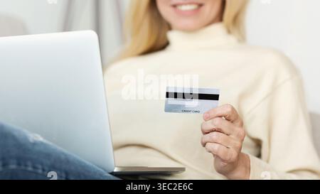 Woman Making Online Payment With Credit Card Stock Photo