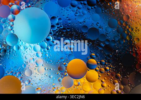 Dynamic Abstract Representation Of Luminous Petroleum Bubbles On Continuous Color Transition Surface Stock Photo