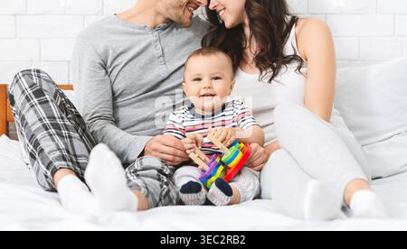 Happy Family Spending Quality Time Together in Cozy Home Environment With Child Playing Stock Photo