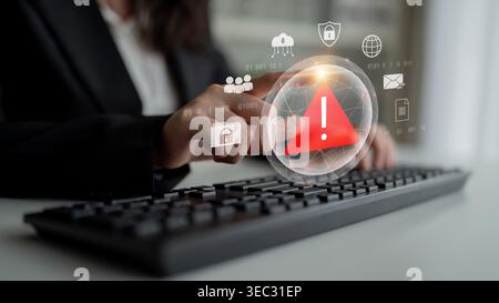 Red warning triangle representing a cybersecurity threat or data breach alert, surrounded by digital security and network protection icons Stock Photo