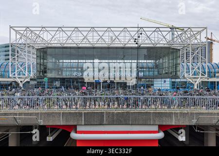Amsterdam, Netherlands - April 11, 2026: The modern entrance of Amsterdam Sloterdijk station featuring a white steel frame and many parked bicycles. Stock Photo