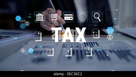Businessman Analyzing Financial Data with Tax Icons and Graphs on a Desk in an Office Environment Focused on Taxes and Financial Management Fluxor. Stock Photo