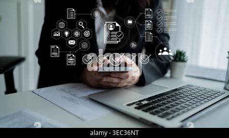 A businesswoman interacts with her smartphone while surrounded by digital workflow icons, symbolizing modern business efficiency and communication in Stock Photo