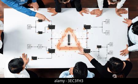Group of Business Professionals Analyzing Risk Management Process with Warning Symbol on Table During Meeting Sigmoid Stock Photo