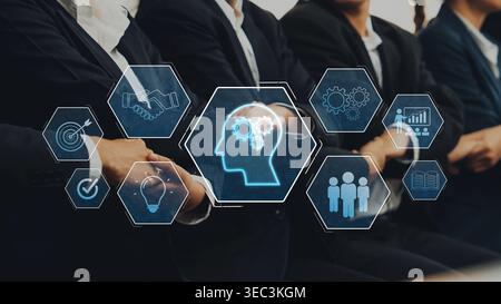 This image depicts a corporate meeting with individuals in suits, enhanced by digital icons representing technology, innovation, and teamwork in a Stock Photo