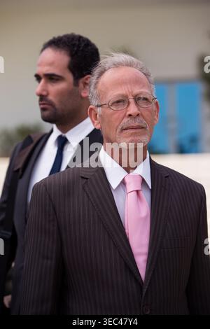 Middle Eastern and Arab business colleagues in suits at a modern corporate office during a meeting Stock Photo