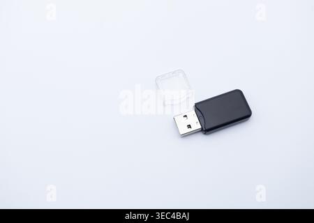 Black usb flash drive with transparent cap off, providing portable data storage on transparent background Stock Photo