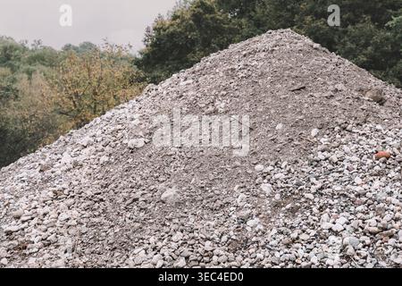 Gravel and rubble forming a large heap outdoors, representing construction materials, earthwork, and waste Stock Photo
