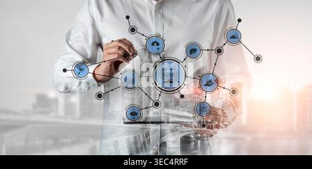 A professional man interacts with a digital interface displaying technology concepts over a vibrant city backdrop, symbolizing innovation and business Stock Photo
