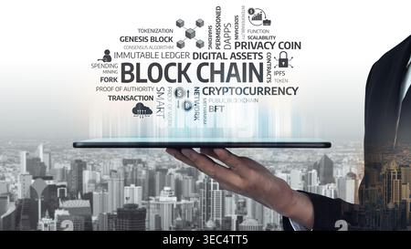 Innovative representation of blockchain technology featuring digital assets and cryptocurrency on a tablet, set against a vibrant urban backdrop Stock Photo