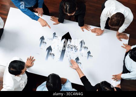 Business Team Analyzing Growth Chart with Arrows Showing Positive Trends and Statistics in an Office Environment Sigmoid Stock Photo