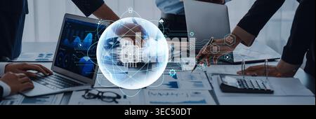 Diverse hands engage in collaborative analysis over laptops and reports, showcasing advanced visualizations of technology and data in a modern Stock Photo
