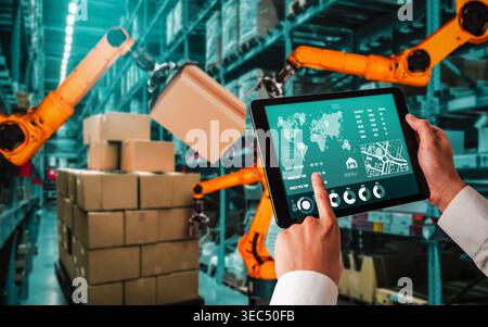 Smart robot arm systems for innovative warehouse and factory digital technology . Automation manufacturing robot controlled by industry engineering Stock Photo