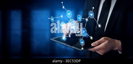 A business professional engages with a digital interface on a tablet, displaying data charts and graphs, representing modern analytical techniques in Stock Photo